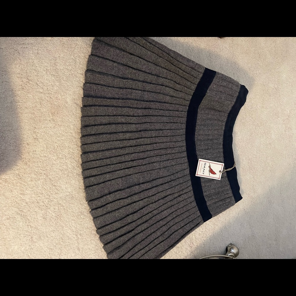 Gant pleated M.B. Kilt in grey with navy and leather clasp. Origins $398.00.